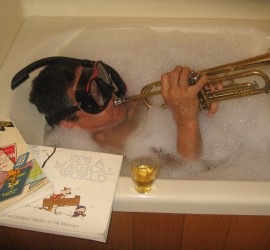 Frank enjoying retirement, in the bath with trumpet