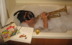 Frank enjoying retirement, in the bath with trumpet